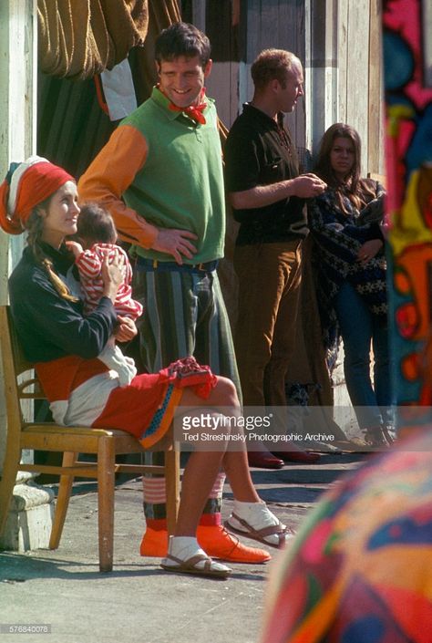 Ken Babbs, also known as the Intrepid Traveler, stands next to Gretchen Fetchin, the Slime Queen, whose original name was Paula Sundsten. She holds her baby, Mouse. They stand with other Merry Pranksters, San Francisco, California. Hippies, Merry Pranksters, Beat Street, Ken Kesey, Tom Wolfe, Beat Generation, Mountain Girl, Velvet Underground, Video Art