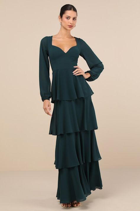 The Lulus Flawless Excellence Emerald Tiered Long Sleeve Maxi Dress was made to take everyone's breath away! This luxe dress has a lightweight woven chiffon composition that shapes princess-seamed cups, a V-neckline (and V-back), and slightly sheer, balloon-style long sleeves with elastic at the cuffs. The flattering, set-in waist tops a tiered, A-line skirt that falls to a sweeping maxi hem. A slender tying strap secures at the back, atop a hidden back zipper/clasp. Fit: This garment fits true to size. Length: Floor length. Bust: Great for any cup size. Waist: Fitted - very fitted at natural waist. Hip: Not Fitted - fuller skirt allows room for hips. Undergarments: May be worn with any standard bra. Fabric: Fabric has no stretch. Dress is lined. Sleeves are unlined and slightly sheer. She