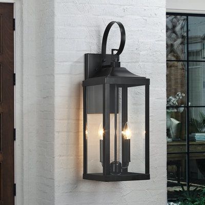 Illuminate your front door or garage with this 2-light outdoor classic new traditional Exterior lantern lighting fixture. It's rated for wet locations, and its sleek frame is made from metal in a bronze finish that complements your decor classic to rustic. It features 4 clear glass panels with its long rectangular shape enclosed in a bronze and sleek clean-lined framework. Pairing the modern design with Candelabra Base bulbs is recommended to fully illuminate the glass and complement the overall Front Door Lighting, Wall Mount Lantern, Exterior Light Fixtures, Black Outdoor Wall Lights, Led Outdoor Wall Lights, Traditional Exterior, Outdoor Light Fixtures, Outdoor Sconces, Austin Design