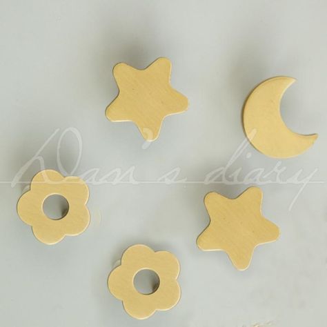 Brass Star/Moon/Flower Drawer Knobs Modern Cabinet Pulls Brass Gold Dresser Pulls Decor Kitchen Cabinet Door Handles CP-0728 The price is for one piece. Material: Brass Measurement: Star Width : 1.30" (33mm) Projection : 0.78" (20mm) Moon Width : 1.30" (33mm) Projection : 0.78" (20mm) Flower Width : 1.10" (28mm) Projection : 0.78" (20mm) 1" long standard screw is included.  * these are all handmade knobs so may have some hurt on the surface during making them. *Dress up or update any cabinet in your home with these unique knobs. It is also great for  jewelry holders, peg hooks, coat racks, mailboxes, craft room decor, toolboxes etc Gold Dresser Pulls, Modern Cabinet Pulls, Handmade Knobs, Unique Knobs, Peg Hooks, Gold Dresser, Kitchen Cabinet Door Handles, Modern Cabinet, Kitchen Cabinet Door