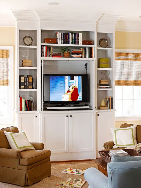 If you don’t want the house television to dominate the whole living room, consider incorporating it into a classic wall of built-in shelving. Tv Bookcase, Living Room Aesthetics, Entertainment Center Design, Hidden Tv, Room Aesthetics, Classic Wall, Family Room Design, Media Center, A Tv