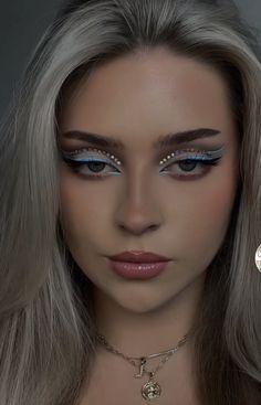 Colored Eyeliner Looks For Blue Eyes, Makeup Ideas For Prom Light Blue Dress, Light Blue Eyeliner Makeup Looks, Blue And White Makeup Ideas, Blue And White Eyeliner Looks, Blue Eyeshadow White Eyeliner, Blue White Eyeliner, Blue Eye Makeup With Gems, Light Blue Eyeliner Makeup