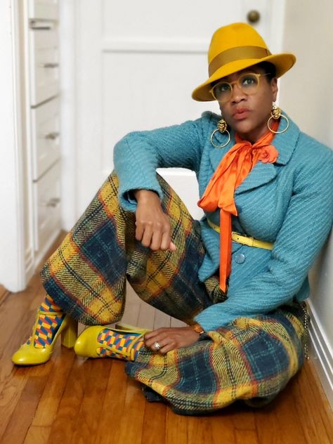 Wide-legged Elaine & George plaid trousers, patterned socks with T-strap pumps, Orange pussy bow Tory Burch Blouse, Turquoise belted blazer, yellow fedora Dressy Jean Outfits Winter, Orange And White Outfits For Black Women, How To Style A Graphic Tee Black Woman, Yellow Fedora Hat Outfit, Plus Size Eclectic Fashion, Sabra Johnson, Funky Outfits For Women, Fedora Hat Outfit, Fedora Hat Outfits