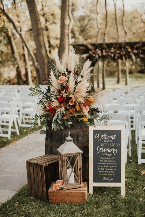 Photo of wedding floral arrangement in fall colors, including pompas grass, red flowers and rust color flowers. Wedding Entrance Decoration, Entrance Decoration Ideas, Fall Wedding Ceremony, Fall Wedding Color Schemes, Western Themed Wedding, Entrance Decoration, Wedding Isles, York Pennsylvania, Wedding Aisle Decorations