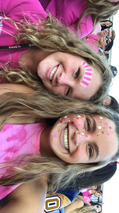 Football Painting Ideas Face, Pink Out Face Paint Ideas, Pink Out Football Game Face Paint, Fnl Makeup, Volleyball Face Paint, Cheer Face Paint Ideas Football, Pink Face Paint School Spirit, Neon Face Paint Ideas For Football Games, Hoco Face Paint Ideas