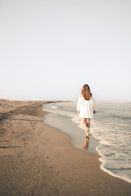 Photo young girl walking on the beach wa... | Premium Photo #Freepik #photo #sea-sand #beach-water #beach-sand #coast Norte, Walking In The Beach, Woman Walking On The Beach, Fanart References, Menstrual Phase, Photoshoot Branding, Sea Walk, Woman On Beach, Photo Sea