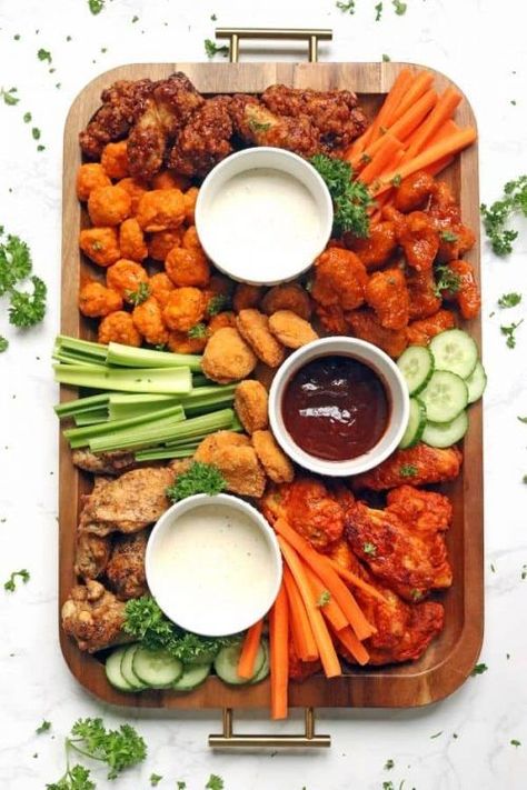 Tailgating Charcuterie Board with Buffalo Chicken Wings, Celery, and Carrots. Get inspired with these Easy Snack Boards for kids, adults, parties, and holidays. How to built a Tailgate Charcuterie board. Serve these easy snack ideas for lunch, dinner,appetizers or a party or gathering! #FrugalCouponLiving #easysnackboards #snackboards #Charcuterieboards #snackideasforadults #snackideas #easyCharcuterieboards #Charcuterieboard #Tailgating #Tailgatingideas #football #footballrecipes Wings And Fries Charcuterie Board, Chicken Board Platter, Build Your Own Party Food, Charcuterie Board Wings, Chicken Wings Board, Wing Boards For Parties, Chicken Charcuterie Board Ideas, Savory Food Board, Chicken Nugget Board