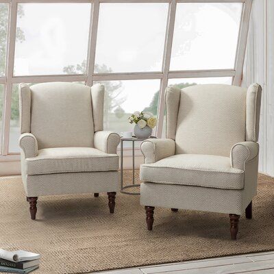 Arriving as a 2-piece set, this armchair shows off eye-catching upholstery in a color palette of your choosing. It has a wooden frame that rests on walnut-toned turned, tapered front legs. The rest of the piece is wrapped in a polyester-blend fabric with a foam-filled interior and sinuous springs that provide plenty of support as you relax. Rolled, recessed arms and a fixed back round out the design. A minimum door width of 34" is needed for home entry. Fabric: Tan Polyester Blend | Armchair - L Wingback Chair Living Room, Traditional Accent Chair, Wolf Den, Velvet Wingback Chair, Traditional Armchairs, Accent Chair Set, Comfortable Space, Sofas For Small Spaces, Patterned Chair