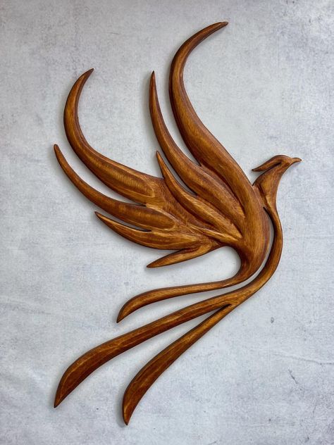 Another piece finished today. Phoenix... - Knight Woodcraft Wood Bird Carving, Wooden Carving Design, Phoenix Knight, Bois Intarsia, Bird Carving Patterns, Bird Silhouette Art, Woodworking Ideas To Sell, Wood Carving Faces, Simple Wood Carving