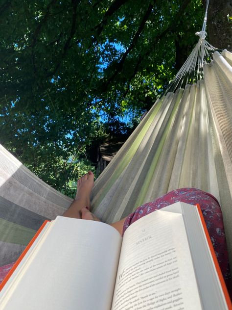 A book on legs in a green hammock Reading On A Hammock, Garden Hammock Aesthetic, Hammock Reading Aesthetic, Cute Hammock Pics, Reading In A Hammock, Summer Hammock Aesthetic, Reading Aesthetic Outside, Hammock Aesthetic Summer, Hammocking Aesthetic