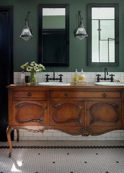 The vanity is a converted antique buffet. Above it, recessed medicine cabinets provide additional storage. Green Walls, White Tile, Hus Inspiration, Green Interiors, Green Bathroom, Melaka, Vintage Bathroom, Bathroom Renos, Traditional Bathroom