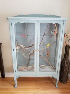 My very first DIY indoor aviary that I repurposed from an old china cabinet. Branches are natural from the trees in my backyard. Bird Avery, Indoor Aviary, Old China Cabinet, Bird Cage Ideas, Reuse Furniture, Animal Enclosures, Diy Bird Cage, Mouse Cage, Budgie Toys