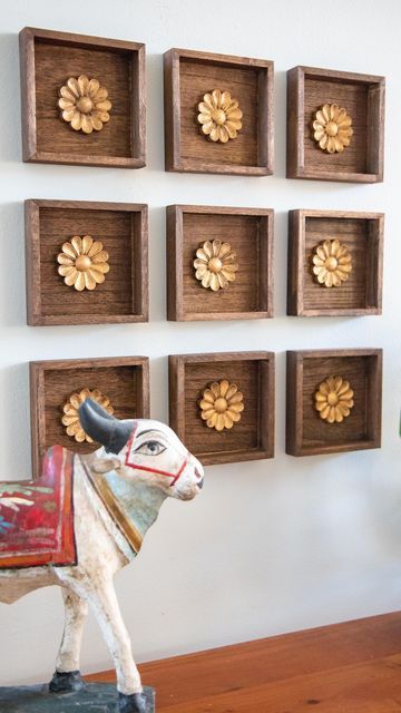 Mitesh | Home & Design on Instagram: "This was such an easy project with a big impact. I found these small wood plaques at the $1 bin @michaelsstores and knew they would work great for what I had in mind. I stained them in a walnut color along with wood rosettes from @amazon. I finished off the rosettes with RubnBuff in antique gold to give it the look of antique brass. Then they were ready for the wall. I grouped together 9 but you could do any number of arrangements. I wanted it to kind of loo Frame Hanging Ideas, Diwali Shoot, Unicorn Stationary, Diy Ideas For Home, Wooden Shelf Design, Wood Rosettes, Wall Art Work, Boho Basket Wall, Plastic Bottle Crafts Diy