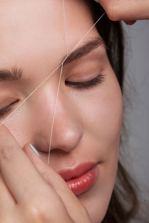 Threading is an ancient way to remove hair, originating in Southeastern Asia. Ahead, check out our complete guide to eyebrow and hair threading. Threading Hair, Face Threading, Hair Threading, Brow Threading, How To Thread, Eyebrow Makeup Tutorial, Eyebrows Makeup, How To Trim Eyebrows, Eyebrow Threading