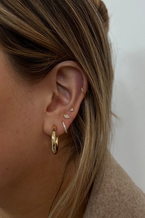 Have fun creating an ear stack you'll love. From solid gold hoops, diamond huggies and studs these earrings are designed to wear daily. Minimalist Ear Scape, Solid Gold Earring Stack, Ear Stacking Ideas Gold, Eating Stack, Gold Earring Stacks, Ear Stacking Ideas, Double Ear Piercings, Earrings Stacking, Earring Stack