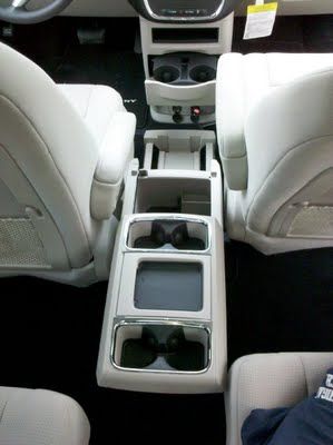 Just a car guy : How many damn cupholders does a passenger need? The Chrysler Town and Country for example has too many, but a brilliant arm... Town And Country Van, Conversion Van, Console Design, Chrysler Voyager, Chrysler Town And Country, Van Conversion, Car Guys, Center Console, Town And Country