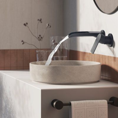 Influenced by modern home decor trends, wall-mounted faucets fit perfectly into the minimalist style. It not only saves space, but also brings a touch of modern elegance to the bathroom. The waterfall spout design on the upper opening allows you to clearly see every drop of water flowing out. Feel the collision with nature. All in all, just a great recommended product to decorate your bathroom. Finish: Black | Tomfaucet Wall Mounted Bathroom Faucet in Black | 9.2 H x 6.3 W x 2.76 D in | Wayfair Bathroom Wall Faucets, Waterfall Sink Faucet, Wall Mounted Bathroom Faucet, Bathroom Faucets Black, Wall Mount Faucet Bathroom Sink, Vanity Backsplash, Wall Faucet, Zen Bathroom, Full Bathroom Remodel