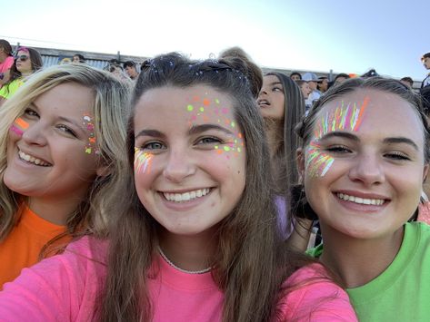 Neon Football Game Theme Outfit Paint, Neon Out Football Game Face Paint, Neon Face Paint Ideas For Football Games, Face Paint Football Games, Hoco Game Face Paint, Facepaint Football, Cute Face Paint Ideas For Football Games, Pep Rally Makeup, Cheer Face Paint Ideas