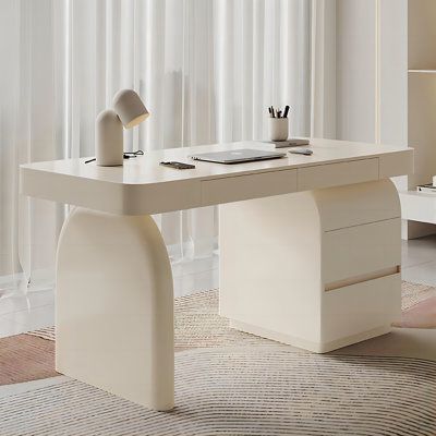 Indulge in the perfect combination of minimalist aesthetics and practicality brought by the cream-style luxury desk. Crafted with multi-layered solid wood, this desk is designed to last for a decade, with a smooth and rounded shape that is not only visually appealing but also embodies modern simplicity. The spacious under-desk space accommodates various sitting heights, providing a comfortable user experience. The environmentally friendly piano lacquer process, coupled with Italian imported cowh Minimalist Office Decor Ideas, Desk Chair Aesthetic, Rounded Desk, Office Desk Aesthetic, Curved Office Desk, Aesthetic Desks, Minimalist Office Desk, Desk Luxury, Writing Desk Wood