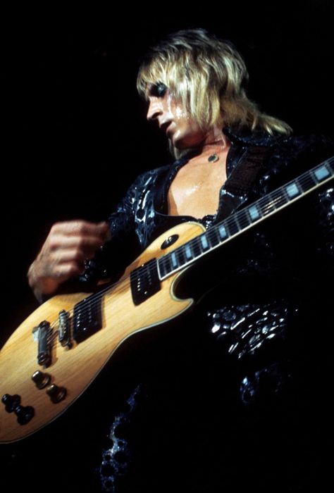 GuitaristMick Ronson (1945 - 1993) performing with David Bowie and his band (as Ziggy Stardust and The Spiders From Mars) at the Hammersmith Odeon, 1973.