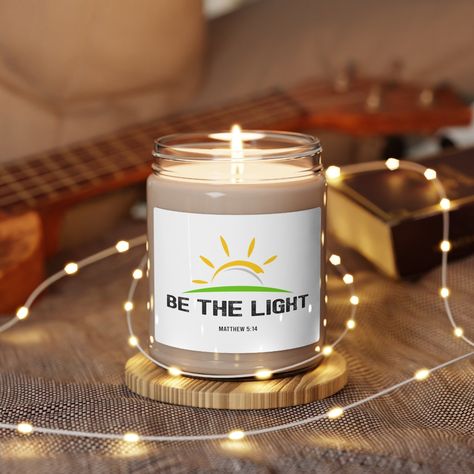 Be The Light Soy Candle, Christian Candle, Bible Verse Candles, Woman Christian Candle Gift, Bible Faith Candle, Matthew 5:14 Sweater ⚫ AVAILABLE SCENTS 1 - CLEAN COTTON 2 - SEA SALT + ORCHID 3 - WHITE SAGE + LAVENDER 4 - APPLE HARVEST 5 - CINNAMON VANILLA Best friend birthday Candle Packed with immersive aromas, these scented candles come in 9oz glass jars and are one size (2.8″ × 3.5") (7.1cm × 8.8cm). Made with 100% natural soy wax blend, each candle features a 100% cotton wick and a permanen