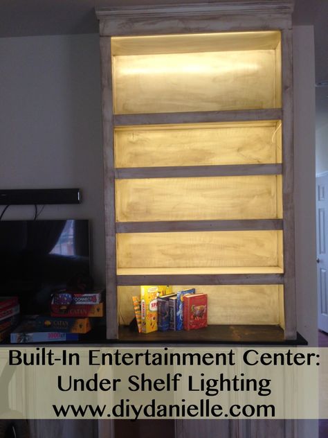 We got a quote about getting LED tape lighting installed and while I’m sure they would’ve done a much more put together job, it was out of our price range. I found this tutorial explaining how to DIY the project so we decided to try it… my husband saw it and didn’t read through fully … Entertainment Center Lighting, Under Shelf Lighting, Bookshelf Lighting, Home Theater Furniture, Built In Entertainment Center, Led Tape Lighting, Home Theater Setup, Led Tape, Entertainment Center Repurpose