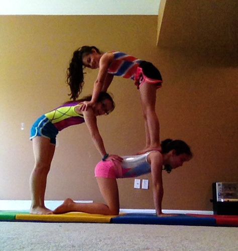 3 person acro stunts Stunts With 3 People, Three Person Yoga Challenge, Three People Yoga Poses Easy, 3 Person Acro Stunts Easy, Fun Stunts To Do With 3 People, Three Person Acro Stunts, Easy 3 Person Yoga Poses, 2 Partner Yoga Poses, 3 People Poses Yoga