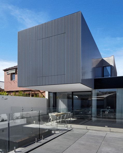 This Australian home received a cantilevered extension with large shutters that provide privacy and protect the windows from the elements. Cantilever Extension, Cantilevered Architecture, Cantilever Architecture, Large Shutters, Cute Small Houses, Architecture Baroque, Black Houses, Australia House, Aluminium Cladding