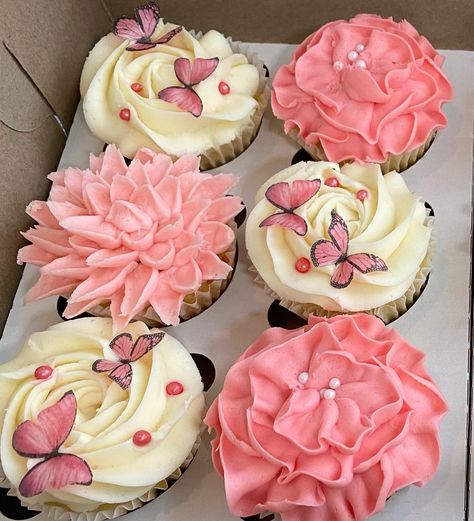 Pink floral cupcakes with edible wafer butterflies. The edible butterflies are made using my Canon TS5000 series Printer which has edible ink printing capabilities. I bought wafer paper to print the butterflies out and then cut them out by hand. If you are good at lining things up to cut on your cricut after printing you could also cut them that way. I have an old version of the printer but I attached a great edible printer with a whole bundle for cake decorating Butterfly Cupcakes Ideas, Butterfly Graduation Party, Pink Butterfly Cupcakes, Cricut Cupcake Toppers, Pink Floral Cupcakes, Cupcake Butterfly, Sweet Crafts, Edible Butterflies, Cupcake Flower Bouquets