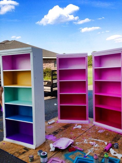 Colored book case, kids book case Rainbow Painted Bookshelf, Painted Book Cases Ideas, Fun Colorful House Interior, Eclectic Playroom Ideas, Pops Of Color Apartment, Colorful Maximalist Decor Office, Funky Painted Bookshelf, Pastel Bookcase, Colorful Interior Decor