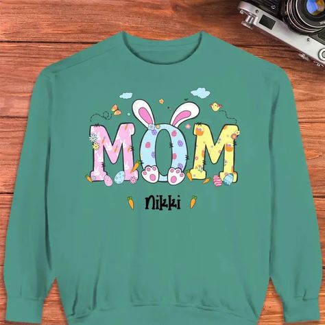 Get ready to hop into Easter with the Mama Bunny Easter sweater! This personalized gift for mom is the perfect way to celebrate the holiday. With fast delivery, it's the ultimate last-minute gift. Plus, get 10% off your first purchase. Take a risk and make this Easter extra special for your adventurous mom! Message: An adorable mom bunny in a personalized yellow hoodie, a thoughtful and customized Easter gift idea. Surprise your risk-taking mom with a festive twist! With a personalized yellow ho Easter Sweater, Easter Sweaters, Life Meaning, Mom Pride, Personalized Easter Gifts, Easter Tees, Mothers Day Decor, Sibling Gifts, Mom Sweater