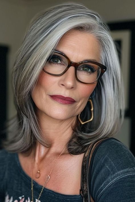 side-parted layered long bob for woman over 50 wearing glasses Long Haircuts For Over 50 Women, Layered Fine Hair Long, Wash And Go Haircut Fine Hair, Glasses For Older Women Gray Hair, Wash And Go Hairstyles, Bob Panjang, White Pixie Cut, Grey Hair Styles, Grey Hair And Glasses