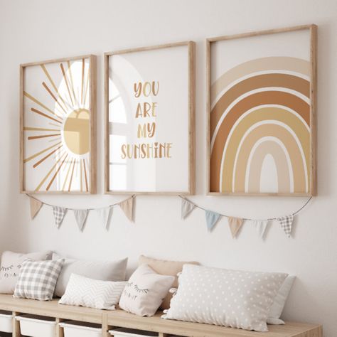 This set of 3 "you are my sunshine" wall art will go perfectly in any child's room or playroom. With earthy terracotta colours to suit gender neutral kids decor. #ad Boho Gender Neutral Twin Nursery, Boho Sunshine Room, Free Printable Wall Art Boho Nursery, You Are My Sunshine Room Ideas, You Are My Sunshine Themed Nursery, Sunshine And Rainbow Nursery, Sun Boho Nursery, Bohemian Rainbow Nursery, Sun Theme Bedroom