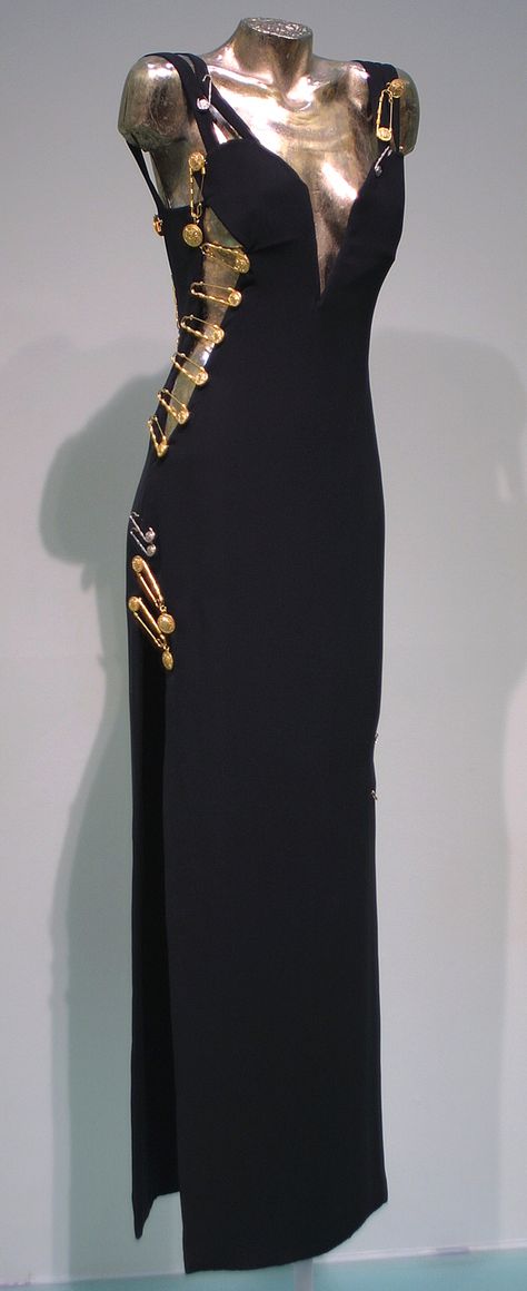 Evening gown worn by Elizabeth Hurley, Spring-Summer 1994, Versace, black viscose and acetate with kilt pin embellishments Versace Black Dress, Vintage Versace Dress, Versace Aesthetic, Safety Pin Dress, Versace Safety Pin, Vestidos Versace, Versace Design, Pin Dress, Versace 90s