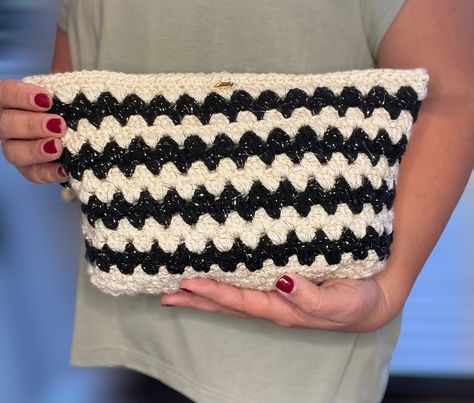 A Black Granny Stitch Crochet Bag . Clutch bag is a versatile and fashionable accessory that can be used as both a toiletry bag or day bag. 🧶 The bag features a zipper closure to keep your belongings safe .🛍 Whether you're going out for a night on the town or running errands during the day, this colorful Granny Stitch Crochet  bag is the perfect accessory to complete your look OPEN TO CUSTOM ORDER 🍀 📍25 x25  cm  📍100% handmade 📍Linned , and a zipper closure  📍I used cotton yarns  The bag color may vary slightly due to different monitor settings_ PLEASE NOTE : Some yarn colors may vary due to the difference in color. INFO ABOUT SHIPPING ✈️ Thank you for considering my shop on Etsy for your purchase! Here's some important information about shipping: All items are shipped with free sta Crochet Toiletry Bag, Granny Stitch Crochet, Crochet Granny Stitch, Granny Stitch, Granny Square Bag, Crochet Shoulder Bag, Accessories Bag, Crochet Fingerless Gloves, Crochet Mittens