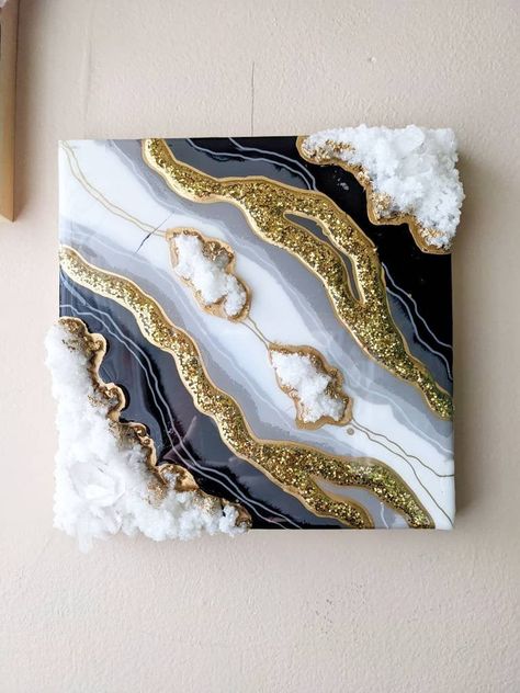 "8\"x8\" 1/2\" H This stylized geode is made in the resin art style!  Beautiful and one of a kind! This piece of wall art will add sparkle and class to any home!" Framed Geode Wall Art, Resin Geode Art Tutorial, Resins Ideas, Crystal Projects, Geode Canvas, Epoxy Resin Wall Art, White And Gold Resin, Resin Art Canvas, Diy Resin Crystals