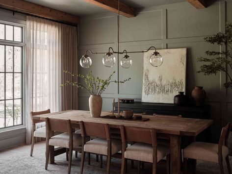 With a neutral palette, elements of different regions, and Everhem window treatments, Lauren Lane's Nashville house was transformed into a home. Board And Batten Wall Ideas, Batten Wall Ideas, Warm Dining Room, Dining Room Window Treatments, Nashville House, Black Painted Walls, Lauren Lane, Beadboard Paneling, Batten Wall