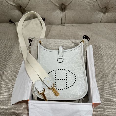 100% Authentic Mini Evelyne in color New White GHW Mini Bag, Hermes Mini Evelyne, Hermes Crossbody Bag, Hermes Evelyn Bag, Hermes Evelyn, Hermes Handbags, Hermes Bags, Cloth Bags, Dust Bag