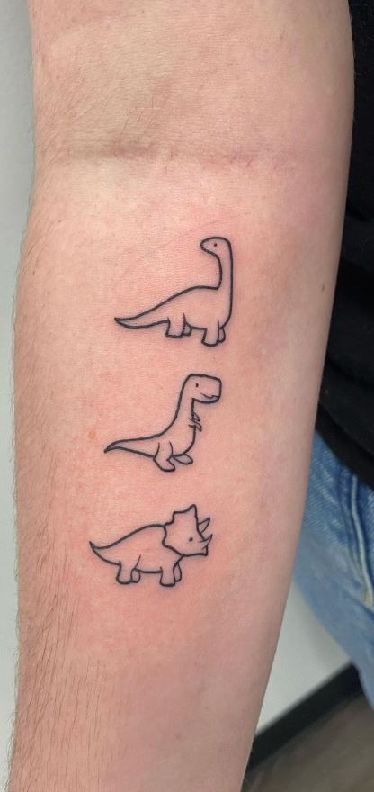 125 Dinosaur Tattoo Designs for the Dino Devotee - Tattoo Me Now Simple Tattoos Dinosaur, Dinasour Tattoo Men, Three Dinosaur Tattoo, Dino Flash Tattoo, Pudge The Fish Tattoo Outline, Dinosaur Tattoo Minimalist, 3 Dinosaur Tattoo, Cool Doodle Tattoos, Dino Tattoos Small