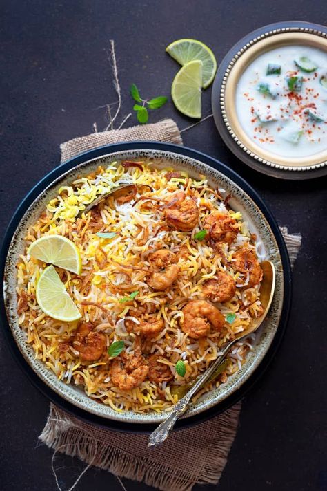 Prawn Biryani - dainty and delightful, a biryani that will make you ask for more and more. Sharing my signature layered prawns dum biryani recipe in restaurant style similar to the Hyderabadi version. It is super simple and easy aromatic rice and shrimp dish that your entire family will thoroughly enjoy. Let's see how to make prawns biryani recipe step by step at home. Prawns biryani aka shrimp biryani is popular as jheenga or jhinga biryani locally in India. Spicy prawns masala layered with ... Indian Shrimp Recipes, Nasi Beriani, Shrimp Biryani, Prawn Biryani Recipes, Prawn Biryani, Dum Biryani Recipe, Dum Biryani, Prawn Recipes, Biryani Recipe