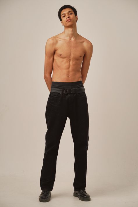 A skinny lightskin model posing in a studio for polaroids. Shirtless, wearing only a black pants and black shoes. Croquis, Figurine, Front Poses Reference, Lean Man Body Reference, Petite Male Body Reference, Standing Men Poses, Body Reference Real Life, Full Body Man Reference, Slim Guy Body Reference