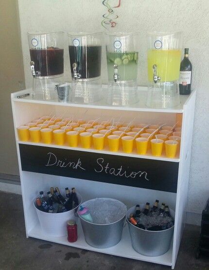 My friend Michael made this drink station for his son's first birthday party.  The chalk board idea gave it the perfect final touch. Drink Station Baby Shower Ideas, Drink Display For Party Beverage Stations, Outdoor Drinks Station, Drink Fountain Ideas, Drink Bar Ideas Party, Drink Stall Ideas, 18th Birthday Drink Ideas, Diy Party Bar Drink Stations, Catering Drink Station