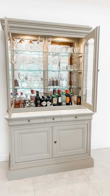 Kelly on Instagram: "How I made our drinks cabinet 🥂 I got asked about this in Q & As a while ago and I’m only getting around to doing this now as life is busy Does it get used ? Every weekend 🤪 Paint used @frenchicpaint salt of the earth Quartz supplied by @granitetopsire #drinkscabinet #homebar #kitchencabinets #upcycling #kitchendesign #drinkup #homedecoration #homeinspiration #homeinspo #diningroom #diningroomdecor #diningroomdesign" Dining Room Drinks Cabinet, Drink Cabinet Upcycled, Glass Drinks Cabinet, Upcycle Drinks Cabinet, Drinks Cabinet Upcycled, Drinks Dresser, Glass Cupboards Kitchen, Drinks Cabinet Ideas, Drinks Cupboard