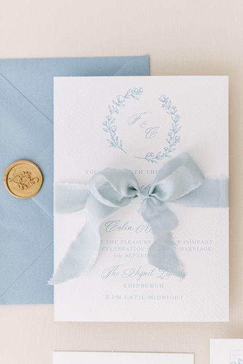 Soft blue illustrated monogram wedding invitation with luxury silk ribbon and a gold wax seal. Dusky blue wedding stationery inspired by the colour palette of the Impressionists for a romantic wedding. Ribbon And Wax Seal, Dusky Blue Wedding, Ice Blue Weddings, Light Blue Wedding Invitations, Pastel Blue Wedding, Blue Wedding Stationery, Baby Blue Weddings, Wedding Invitation Ribbon, Monogram Wedding Invitation