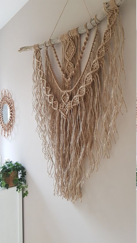 "Macrame Wall hanger on a tree branch, Handmade from natural material Jute / Sisal, this wall decoration in Ibiza style creates atmosphere and warmth in the house and in the garden Size: Driftwood width 100 cm (\"39) length from dowel 90 cm (\"35) Other dimensions and colors are possible, please sent a message This unique, exclusive pendant is made to order. If you have any questions or want advice, please send a message https://www.etsy.com/nl/shop/CordAndMoreCreations?ref=seller-platform-mcnav Jute Wall Art, Tapestry Hanger, Driftwood Macrame, Jute Macrame, Macrame Wall Hanger, Boho Macrame Wall Hanging, Seashell Wall Art, Macrame Dream Catcher, Hanger Diy