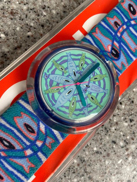 This is the fabulous artist rendered POP swatch watch.  It is the larger POP face and features fish.  It has the signature elastic POP watch band with fish and a snake design.  This is super unique.  T The watch is in running condition with a new battery.  A great find for the Swatch collector. Early 200s, Kenny Scharf, Vintage Swatch Watch, Red Watch, Cartoon Fish, Vintage Timepiece, Retro Watches, Swatch Watch, Snake Design