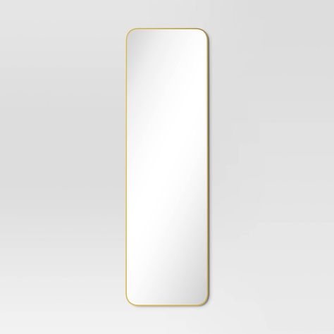Add simple reflective style to your bathroom or bedroom door with this Over-the-Door Mirror Metal from Project 62™. The over-the-door mirror brings space-saving style into your home. It features a slim rectangular design with rounded edges for a clean modern look, along with a reflective flat surface in the center to create the illusion of extra space. The full-length mirror comes with a sturdy metal frame for lasting use. Plus, it's quick and easy to install. Project 62™: Modern pieces made for Long Mirror In Bedroom, Full Length Mirror Gold, Room Wishlist, Over The Door Mirror, Long Mirror, Gold Door, Full Body Mirror, Mirror Metal, Body Mirror