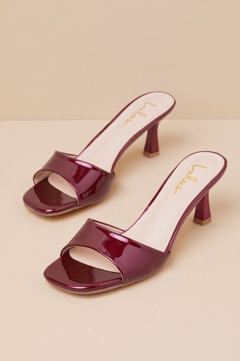 The Lulus Honorine Burgundy Patent High Heel Slide Sandals are seriously fabulous, and will make any ensemble even more so! These must-have heels have a shiny faux patent leather construction, shaping a trendy square footbed and a wide, tapered toe strap. Eye-catching sculpted heel completes the sleek slide-on design. From jeans and a tee to flirty cocktail dresses, easily elevate all your most iconic looks with these sensational sandals! 2. 75" sculpted heel. Cushioned insole. Rubber sole has n