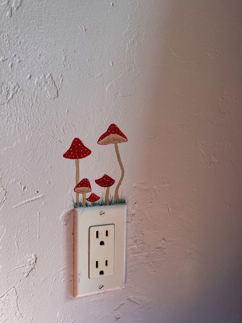 #painting #mushrooms #wallpaintingideas #outletpainting #aesthetic Mushroom Dresser Painting, Painted Mushrooms On Wall, Wall Painting Ideas Cottagecore, Fairy Door Bedroom, Mushroom Wall Art Paint, Painting Around Light Switches, Things To Paint On Your Wall Aesthetic, Mushroom Painting On Wall, Mushroom Door Painting