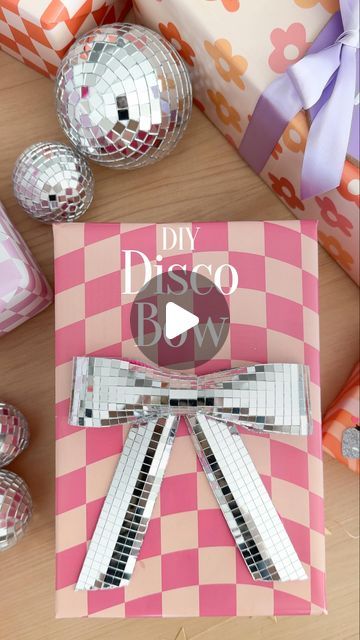 Stephanie Hanna on Instagram: "DIY Disco Bows 🎀🪩 The skies the limit with these! Start with wired ribbon, stick the disco tiles onto the ribbon, then use a glue gun to attach it. Can’t wait to celebrate Maven tomorrow. 🎉 My baby is getting so big!
Inspo: @kailochic 
.
.
.
.
.
#giftidea #giftwrapping #giftwrappingideas #giftwrappingskills #giftinspo #giftwrapinspo #discoball #discobow #discoballdecor #diygiftwrap" Disco Letters Diy, Diy Big Bow, Disco Tiles, Cowgirl Gifts, Disco Theme, Gift Inspo, Diy Letters, Diy Gift Wrapping, Bow Making